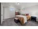 Basement bedroom with carpet flooring, a dresser, and natural light from windows at 2855 Albion St, Denver, CO 80207