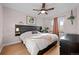 Relaxing bedroom with a ceiling fan, large windows, and warm natural light at 2855 Albion St, Denver, CO 80207