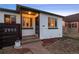 Charming home featuring a quaint yard, sidewalk, and minimalist landscaping, perfect for modern living at 2855 Albion St, Denver, CO 80207