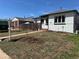 Charming home featuring a quaint yard, sidewalk, and minimalist landscaping, perfect for modern living at 2855 Albion St, Denver, CO 80207