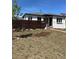Charming single-story home featuring a modern horizontal fence and freshly landscaped front yard with walkway at 2855 Albion St, Denver, CO 80207