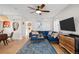 Inviting living room with stylish decor, hardwood floors, and ample seating, perfect for modern living at 2855 Albion St, Denver, CO 80207