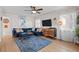 Inviting living room with stylish decor, hardwood floors, and ample seating, perfect for modern living at 2855 Albion St, Denver, CO 80207