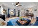 Bright living room with hardwood floors, stylish furniture, and large windows at 2855 Albion St, Denver, CO 80207