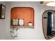 Unique wall niche features decorative plants, framed art, and a stylish mirror, adding character to the room at 2855 Albion St, Denver, CO 80207