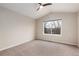 Spacious bedroom featuring neutral carpet, fresh paint, and a window at 9450 Troon Village Dr, Lone Tree, CO 80124