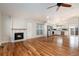 Inviting living room with a fireplace, hardwood floors, and an open-concept design at 9450 Troon Village Dr, Lone Tree, CO 80124