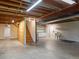 Unfinished basement offers a stairway to the main level, shelving and sink at 11824 E Basswood Ln, Franktown, CO 80116