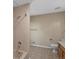 Bathroom with tiled shower and tile flooring, vanity with sink and toilet at 11824 E Basswood Ln, Franktown, CO 80116