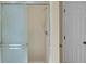 Bathroom featuring a shower with glass doors and neutral-colored tiling at 11824 E Basswood Ln, Franktown, CO 80116