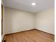 Bedroom boasts hardwood floors, natural light, and neutral wall color at 11824 E Basswood Ln, Franktown, CO 80116