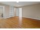 Bedroom boasts hardwood floors with two built-in shelves and two doorways at 11824 E Basswood Ln, Franktown, CO 80116