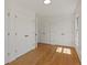Bedroom featuring hardwood floors, multiple closets, and a window allowing natural light at 11824 E Basswood Ln, Franktown, CO 80116