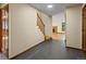Inviting foyer features tile floors, staircase, and access to the living room at 11824 E Basswood Ln, Franktown, CO 80116