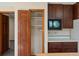 An eye-level of a kitchen area with cabinet and pantry space, showcasing the kitchen storage and organization at 11824 E Basswood Ln, Franktown, CO 80116