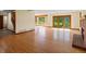 Expansive living area boasting hardwood floors, a cozy fireplace, and large sliding doors for natural light at 11824 E Basswood Ln, Franktown, CO 80116