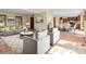 Spacious open-concept living room and dining area with hardwood floors and ample natural light at 11824 E Basswood Ln, Franktown, CO 80116