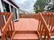View of backyard and wood deck from the stairs, showing wood fencing and the exterior of a house at 19828 E Brown Pl, Aurora, CO 80013