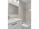 Bathroom featuring tiled shower and tub, white marble vanity with modern black hardware at 19828 E Brown Pl, Aurora, CO 80013