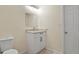 Bathroom featuring a modern white vanity with marble top and a tiled floor and square mirror at 19828 E Brown Pl, Aurora, CO 80013