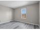Bedroom featuring wood floors and a large window with view at 19828 E Brown Pl, Aurora, CO 80013