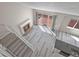 Open floorplan living room with sliding glass door to deck and stairs at 19828 E Brown Pl, Aurora, CO 80013