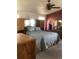 Cozy bedroom features a queen bed, ceiling fan, and built-in cabinets for ample storage space at 1998 E 100Th Pl, Thornton, CO 80229