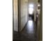 Long hallway with tile flooring connecting the different spaces of the home at 1998 E 100Th Pl, Thornton, CO 80229