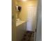 Efficient laundry room with washer, dryer, and shelving, blending functionality and storage space at 1998 E 100Th Pl, Thornton, CO 80229