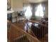 Inviting living room showcasing hardwood floors, fireplace and large windows, with plenty of natural light at 1998 E 100Th Pl, Thornton, CO 80229