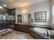 Luxurious bathroom with a glass enclosed shower and separate soaking tub at 23130 E Del Norte Cir, Aurora, CO 80016