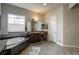 Serene bathroom features a soaking tub and vanity with ample counter space at 23130 E Del Norte Cir, Aurora, CO 80016