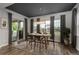 Bright dining area with large windows, a modern chandelier, and stylish furnishings at 23130 E Del Norte Cir, Aurora, CO 80016