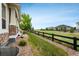 The well-kept lawn features a convenient walkway with the yard bordering an elegant black fence at 23130 E Del Norte Cir, Aurora, CO 80016