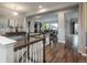 Elegant foyer with hardwood floors, staircase, and an open view to the bright and airy living area at 23130 E Del Norte Cir, Aurora, CO 80016