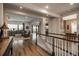 Open-concept foyer featuring hardwood floors, staircase, and seamless transition into the living areas at 23130 E Del Norte Cir, Aurora, CO 80016