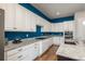 Well-appointed kitchen with ample counter space, white cabinetry, and modern appliances at 23130 E Del Norte Cir, Aurora, CO 80016