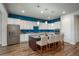 Bright kitchen features a large island with seating and stainless steel appliances at 23130 E Del Norte Cir, Aurora, CO 80016