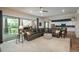 Comfortable living room with an open floor plan, a large sectional sofa, and abundant natural light at 23130 E Del Norte Cir, Aurora, CO 80016
