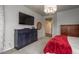 Main bedroom features built-in storage and a television, offering a relaxing retreat at 23130 E Del Norte Cir, Aurora, CO 80016