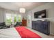 Comfortable main bedroom with ample natural light, dresser and sitting area at 23130 E Del Norte Cir, Aurora, CO 80016