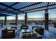 Outdoor patio area with stylish pergola and comfortable seating, perfect for entertaining and relaxation at 23130 E Del Norte Cir, Aurora, CO 80016
