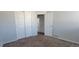 Bedroom with standard electrical outlets, view of closet, and entry to en-suite bathroom with sink at 2732 E 132Nd Pl, Thornton, CO 80241