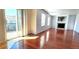 Spacious living room with a sliding glass door to deck, fireplace and hardwood floors at 2732 E 132Nd Pl, Thornton, CO 80241