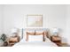 Bright bedroom features a comfortable bed with side tables and soft, neutral tones at 4025 E Martin Luther King Jr, Denver, CO 80207
