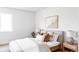 Cozy bedroom features a comfortable bed with warm tones and natural light at 4025 E Martin Luther King Jr, Denver, CO 80207