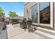 Backyard patio area with concrete, grilling area, outdoor access, and privacy fence at 1551 S Grant St, Denver, CO 80210