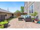 Relaxing backyard patio with outdoor seating, a fire pit, and a lush garden at 1551 S Grant St, Denver, CO 80210