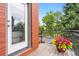 Balcony view featuring brick facade, railing, and neighborhood scenery at 1551 S Grant St, Denver, CO 80210