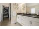 Elegant bathroom with double vanity, granite countertop, large mirror, and walk-in closet at 1551 S Grant St, Denver, CO 80210